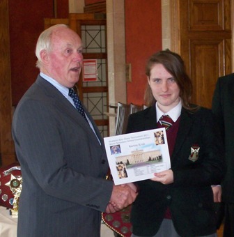 Karina Kruk the Senior Champion receives prize from Kieran McCarthy MLA