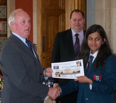 Radhika Gupta receives award from Kieran McCarthy