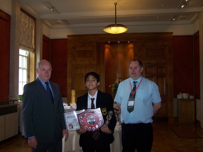 Kieran McCarthy MLA awards Kevin Robbin with winners shield