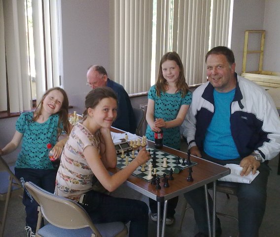 The Eachus Family Enjoying Chess 