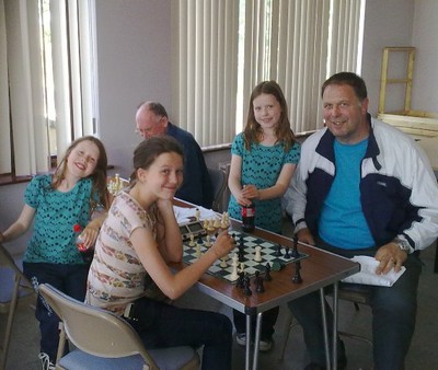 The Eachus Family Enjoying Chess 