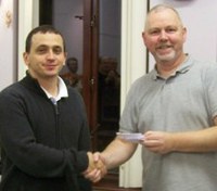 Tournament winner, Gabor Horvath receiving prize from Damien Cunningham