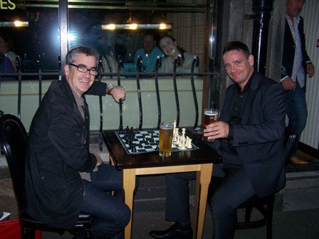Friends enjoying a drink and a game