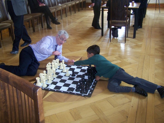 Brian Wilson and Raghav playing the large chess set 